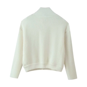 Back view of cream knit sweater showing ribbed texture and high collar design