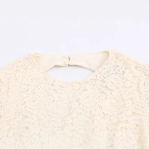 Elegant off-white lace dress featuring a backless design with double button closure
