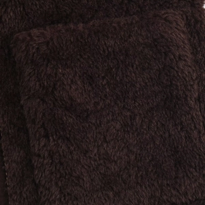 Macro texture of coffee brown faux shearling fabric on the long sleeve high neck coat