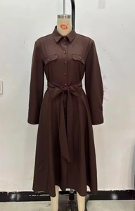 Detail of dark brown long-sleeved button-down dress with collar and waist tie belt