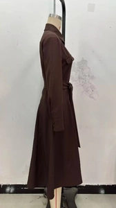 Detail view of coffee brown long sleeve shirt dress with belted waist and utility chest pockets