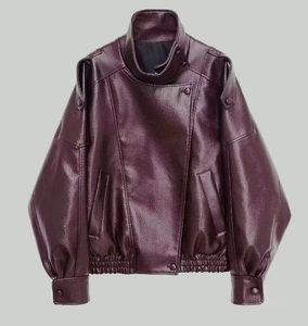 Detail of burgundy faux leather biker jacket with stand collar and textured grain finish