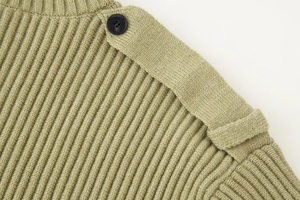 Close-up of grass green rib knit sweater featuring shoulder straps and black button detail