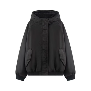 Women's oversized black hooded winter parka with fleece lining and ribbed cuffs
