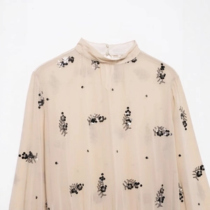 Beige sequined semi-transparent long sleeve blouse with elegant high collar and floral pattern