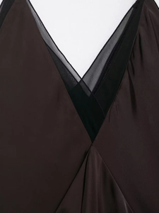 Close-up of deep brown satin sleepwear with black lace patchwork on the V-neckline