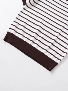 Close-up of brown and white striped knit top showing the ribbed hem detail and texture
