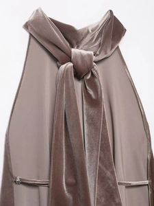 Detail of elegant satin halter neck top with stylish tie-knot ribbon in dusty mauve fabric