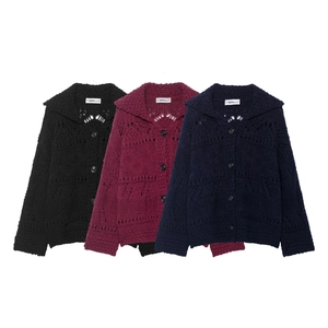 Detailed view of hollow knit patterns and collar designs on three colorful cardigans