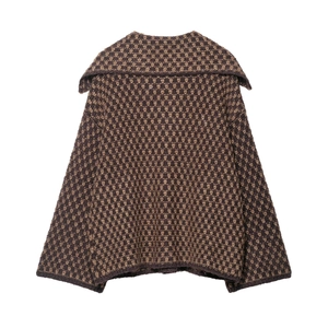 Macro shot of retro geometric knit texture and wide sailor collar on the cardigan back
