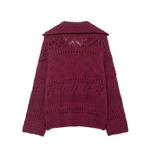 Detailed macro view of the maroon chunky knit cardigan showing hollow out floral patterns