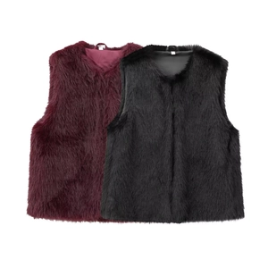 Detail view of burgundy and black faux fur vests showing soft texture and fluffy long-pile finish