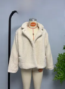 Close-up of cream faux fur jacket texture with thick lapel design and soft fleece finish