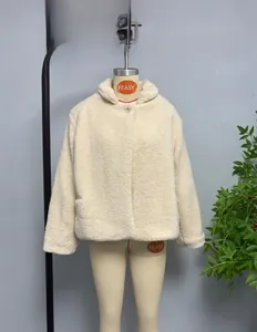 Detail shot of plush cream teddy fleece fabric on stylish stand collar coat for women