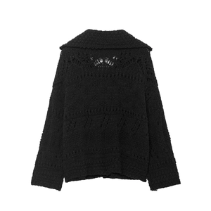 Back view of black chunky knit cardigan featuring symmetric hollow openwork patterns