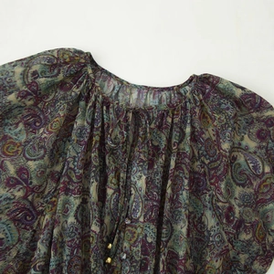 Bohemian paisley print mini dress with metallic threads and a tie neckline detail