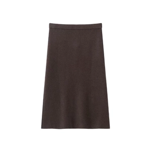 Detail of high waist dark brown knit midi skirt with elegant A-line silhouette and texture