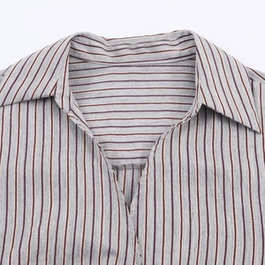 Classic striped button-down shirt with V-neck lapel and detailed woven texture in grey