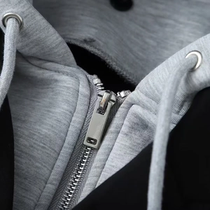 Black and grey contrast hooded jacket with silver zipper and drawstring detail