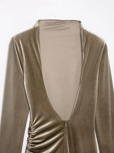 Detail view of olive brown velvet fabric with refined side ruching and invisible zipper