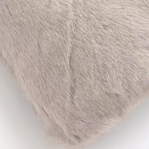 Macro view of plush faux mink fur texture in elegant light gray with soft long fibers
