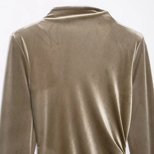 Elegance high neck velvet dress in metallic gold with padded shoulders and draped texture