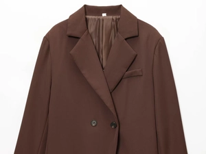 Macro detail of dark coffee double-breasted blazer with notch lapels and resin buttons