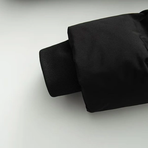 Detail shot of the ribbed knitted cuffs on a black windproof winter jacket