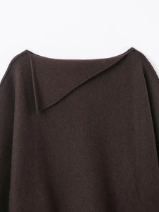 Close-up of brown knit set featuring a unique asymmetrical fold collar and soft texture
