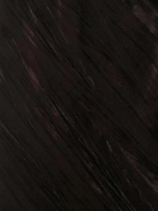 Close-up of premium velvet fabric with elegant vertical pleats and soft glossy texture