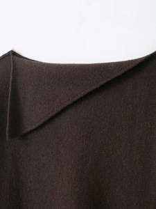 Detail shot of a dark brown knit sweater featuring a refined fold-over collar design