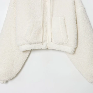 White sherpa fleece zip-up hoodie with drawstring and cozy front pockets for women