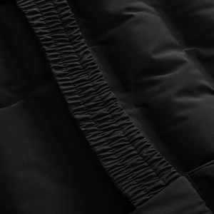 Detailed close-up of elastic waist pleats on a black waterproof winter coat
