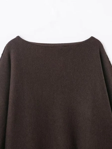 Detail of the knit boat neckline on this dark brown sweater with high-quality texture