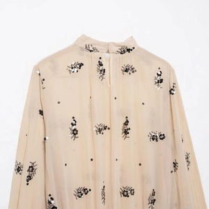 Elegant beige sheer chiffon blouse with sequin flower embroidery and high collar detail