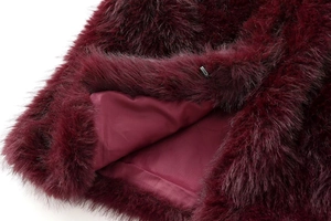 Detail of burgundy faux fur vest showing soft texture and hidden metal hook closure