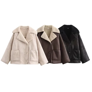 Detailed view of women's shearling jackets in beige, brown and black with large pockets