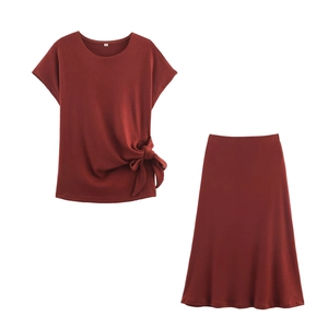 Women burgundy knit two-piece set featuring short sleeve knot top and midi skirt
