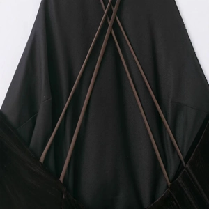 Elegant black bandage dress featuring criss-cross back straps and tassel details