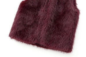 Detailed close-up of dark red faux fur texture with high gloss for winter vests