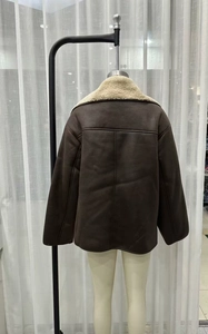 Back view of a brown faux suede jacket with white shearling collar and seam details