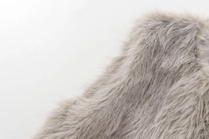Detail of light gray faux fur vest showing soft texture and high-quality fluffy fibers