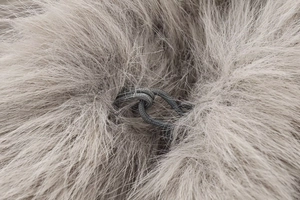 Macro shot of gray faux fur texture and woven drawstring on fashion casual vest
