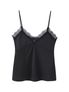 Close-up of black satin camisole featuring delicate eyelash lace trim and deep V-neckline