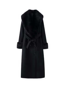 Detail of elegant black wool coat featuring premium faux fur collar and matching waist belt