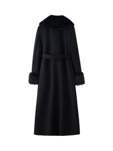 Rear view of black wool coat featuring plush fur collar and matching waist belt