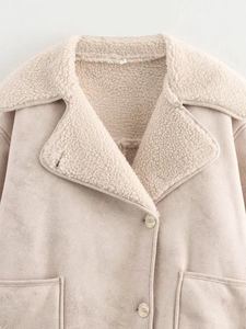 Detail shot of beige faux suede and shearling jacket with large lapel and pockets