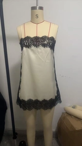Detail of cream silk camisole top featuring black floral lace trim on an S-size mannequin