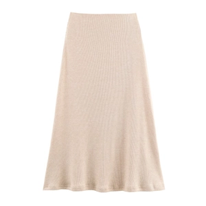 Detailed close-up of beige ribbed knit midi skirt with high waist and A-line silhouette