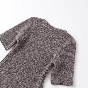 Brown textured knit short-sleeve top featuring a classic crew neck and fringe details